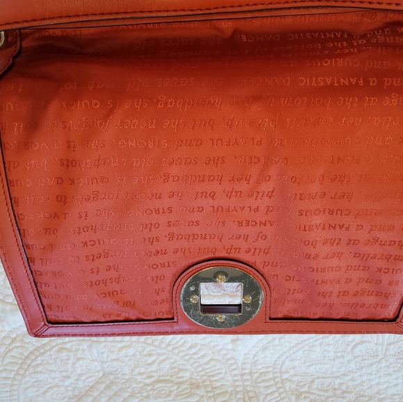 Kate Spade orange leather purse.  12" x 9" Two side zippers three inside pockets - Picture 7 of 11